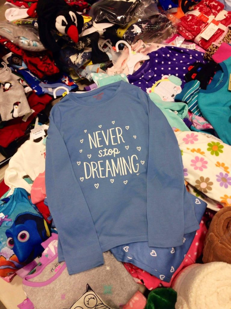 A pyjama shirt that says, "Never stop dreaming".